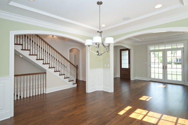 420 Washington Street Glenview, IL 60025 - Photo 3 of 17 a view of an entryway with wooden floor and a chandelier