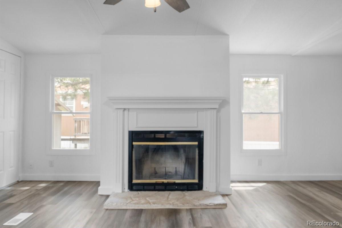 400 Hickory Street Fort Collins, CO 80524 - Photo 2 of 28 an empty room with windows and fireplace