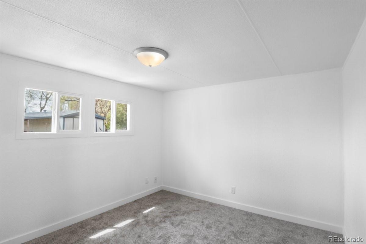400 Hickory Street Fort Collins, CO 80524 - Photo 22 of 28 an empty room with windows