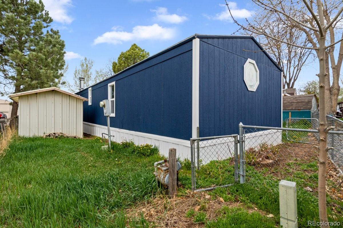 400 Hickory Street Fort Collins, CO 80524 - Photo 26 of 28 a backyard of a house with plants and outdoor seating