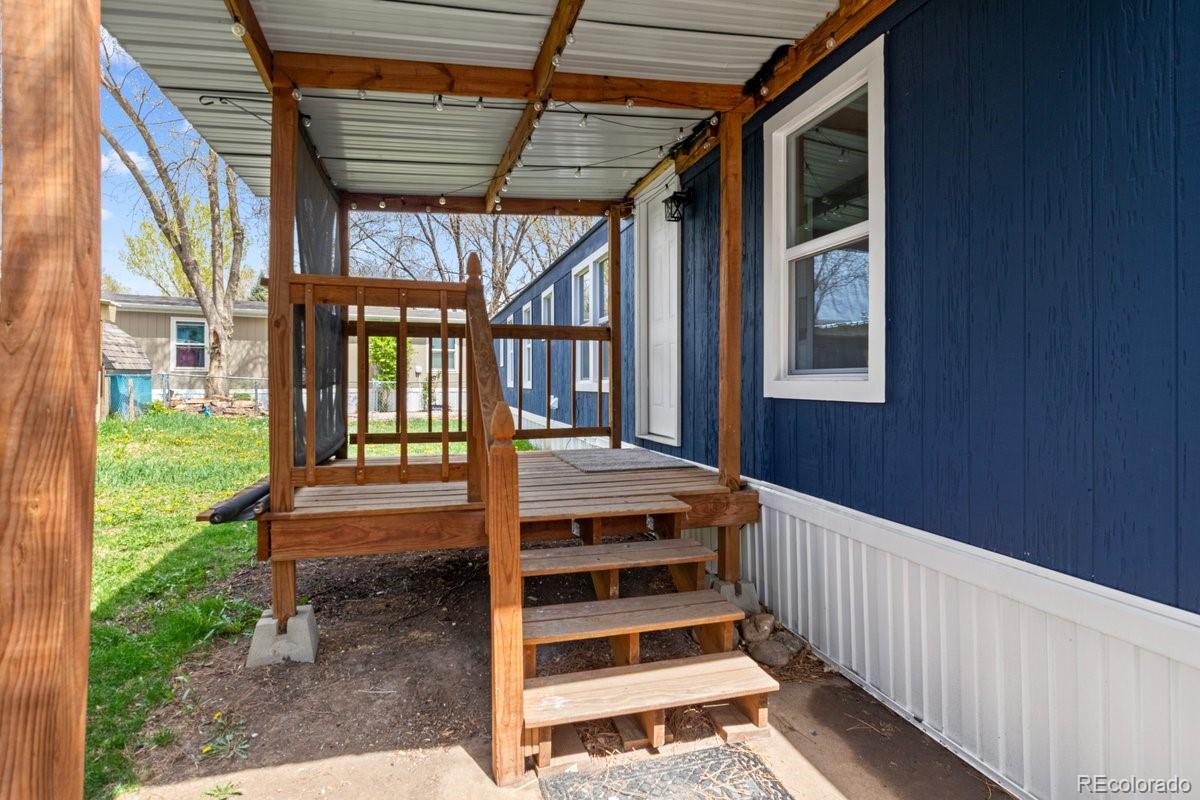 400 Hickory Street Fort Collins, CO 80524 - Photo 27 of 28 a view of a porch with wooden floor and fence