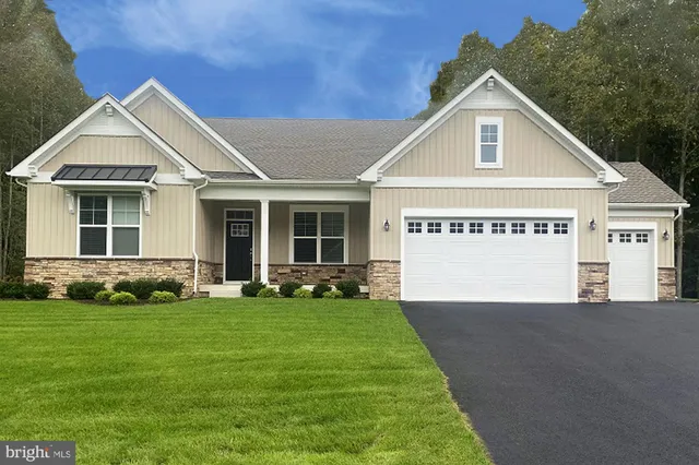 a view of a house with a yard and potted plants