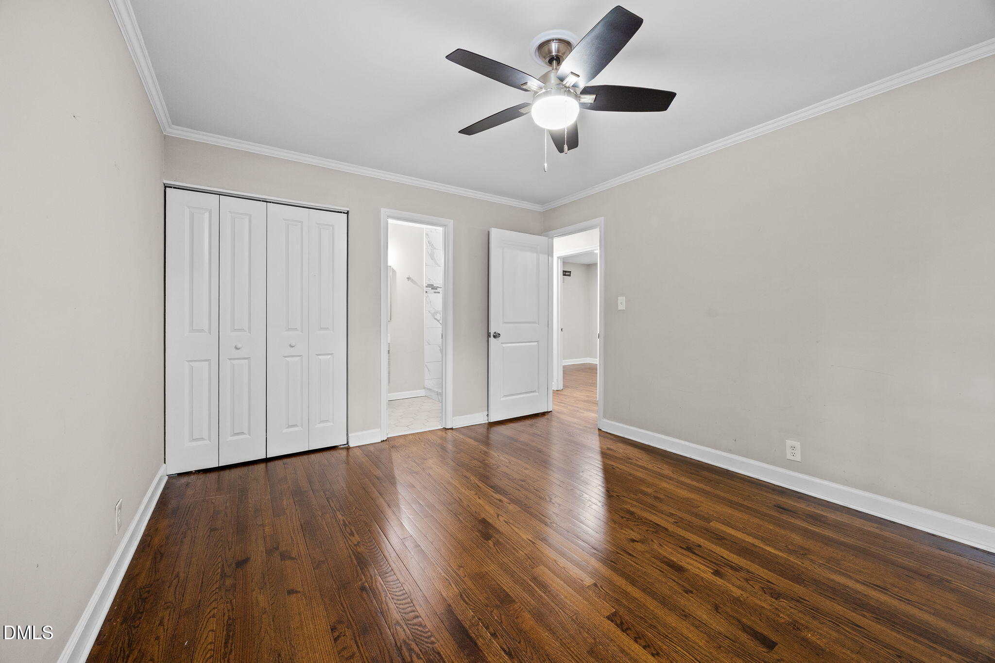 2950 Glenridge Drive Raleigh, NC 27604 - Photo 19 of 53 an empty room with wooden floor and windows
