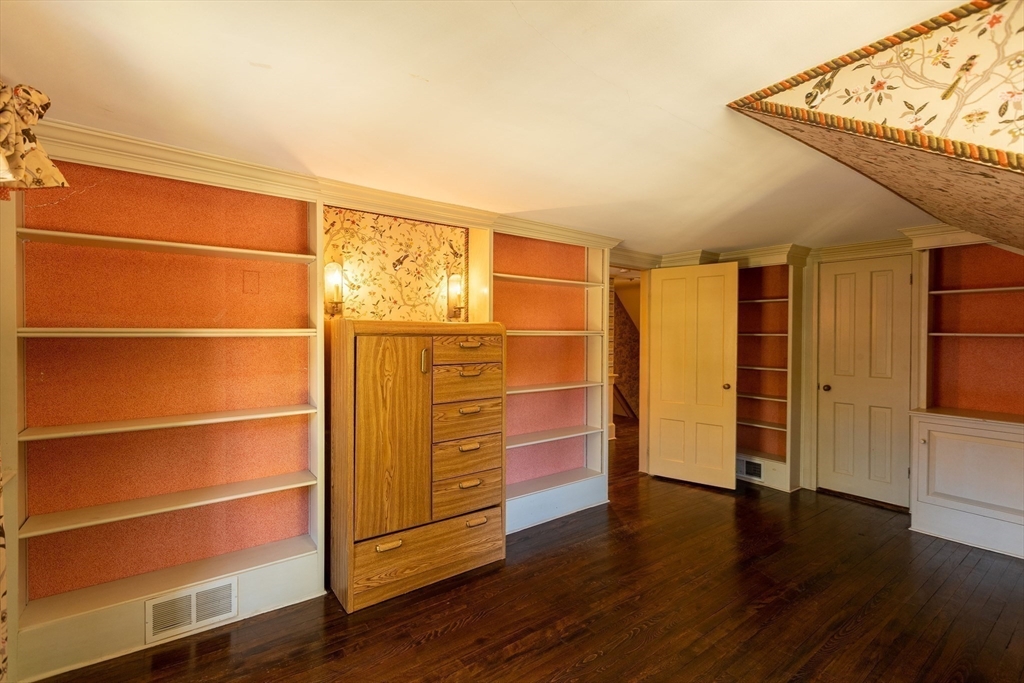105 Church Street Ware, MA 01082 - Photo 22 of 41 a view of an empty room with wooden floor and a window