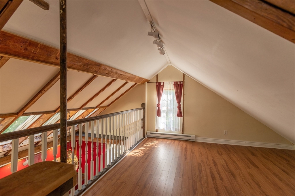 105 Church Street Ware, MA 01082 - Photo 31 of 41 a view of a hallway with wooden floor and stairs