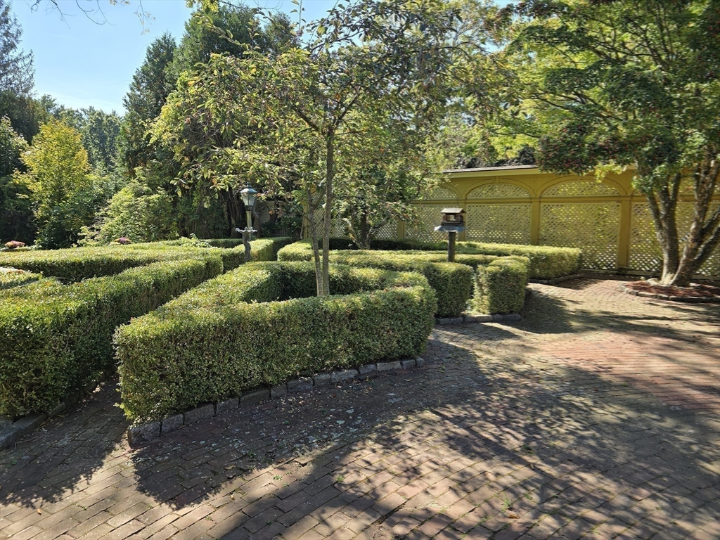 105 Church Street Ware, MA 01082 - Photo 35 of 41 a view of a backyard with plants and a patio