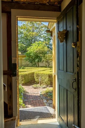 a room with wooden floor and a window