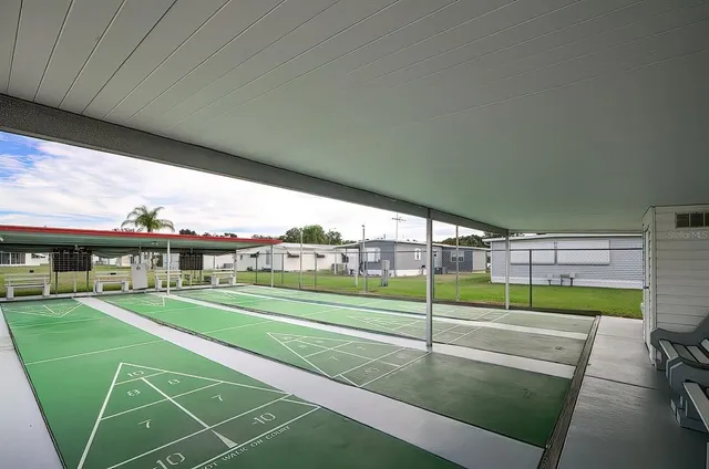 a view of a swimming pool with a patio