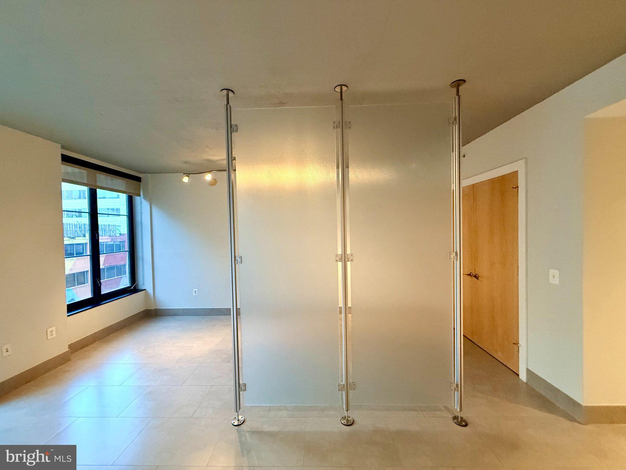 1133 14th Street Northwest, Unit 503 Washington, DC 20005 - Photo 9 of 29 Modern space with sleek glass divider.