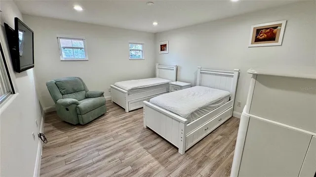 a bedroom with a bed and a couch