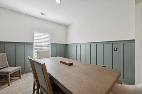 a living room with fireplace furniture and a flat screen tv