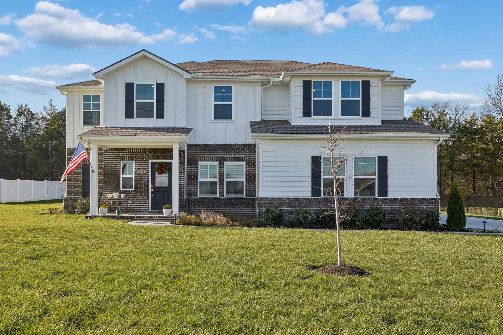 303 Persimmon Way Lebanon, TN 37087 - Photo 3 of 100 a front view of a house with garden