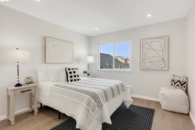 a bedroom with a large bed and a window