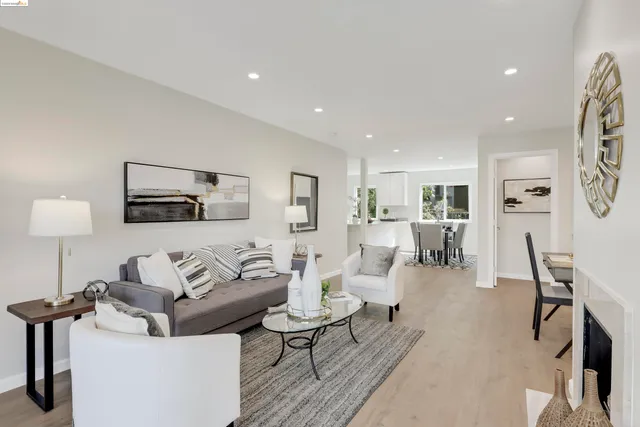 a living room with furniture and a lamp