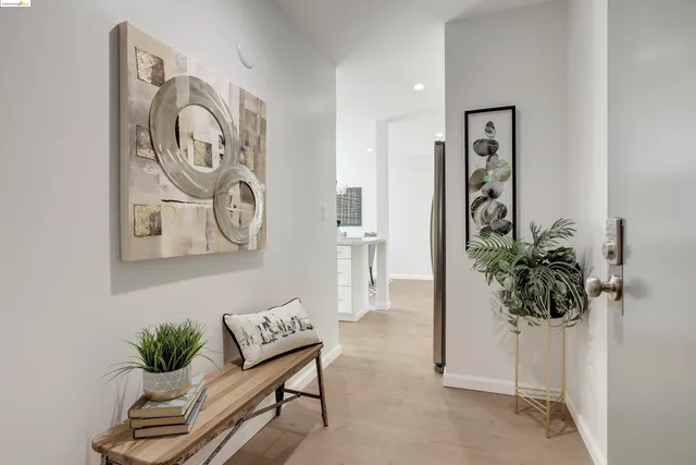 a view of a hallway with paintings on the wall