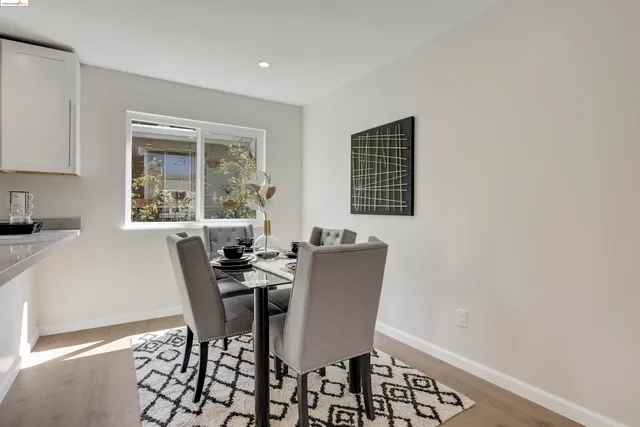 a view of a dining room with furniture and window