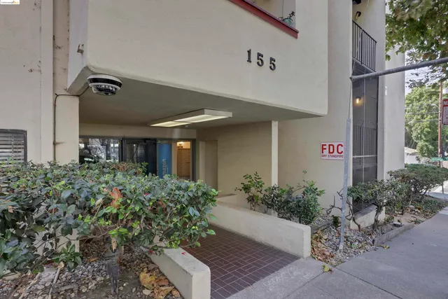 a front view of a house with lots of green space