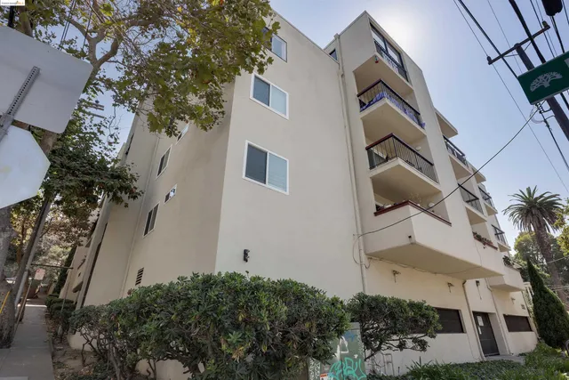 a view of a cars parked on the side of a street