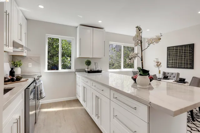 a kitchen with sink cabinets and window