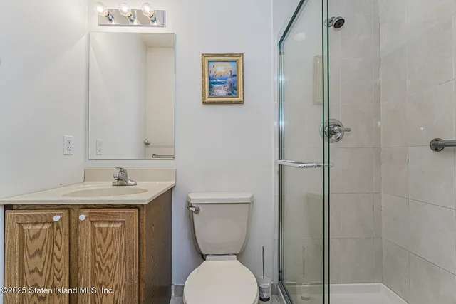 a bathroom with a toilet sink and shower