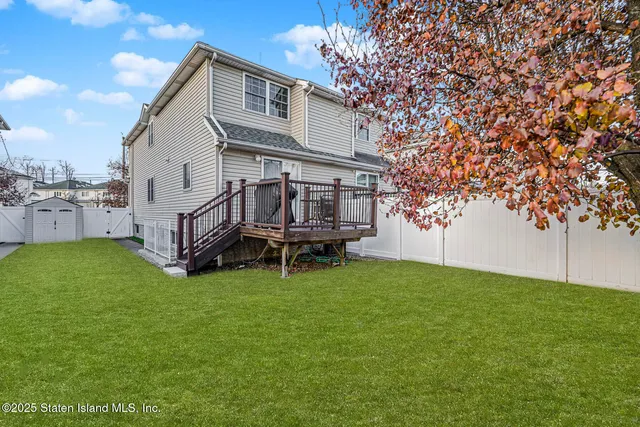 a view of a house with a back yard