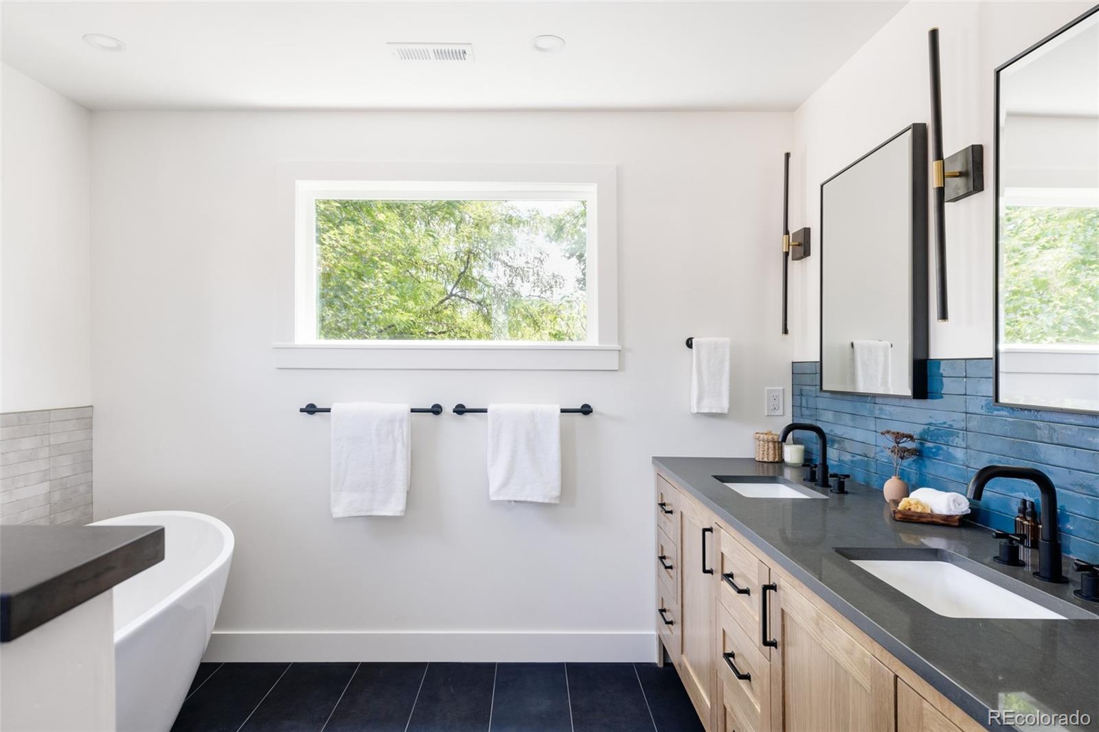 832 Adams Street Denver, CO 80206 - Photo 20 of 39 a kitchen with a sink cabinets and a window