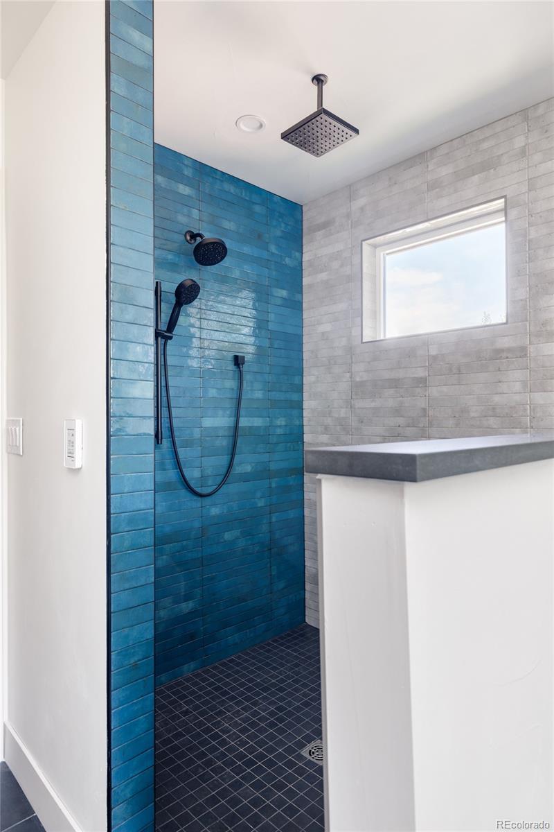 832 Adams Street Denver, CO 80206 - Photo 23 of 39 a bathroom with a shower