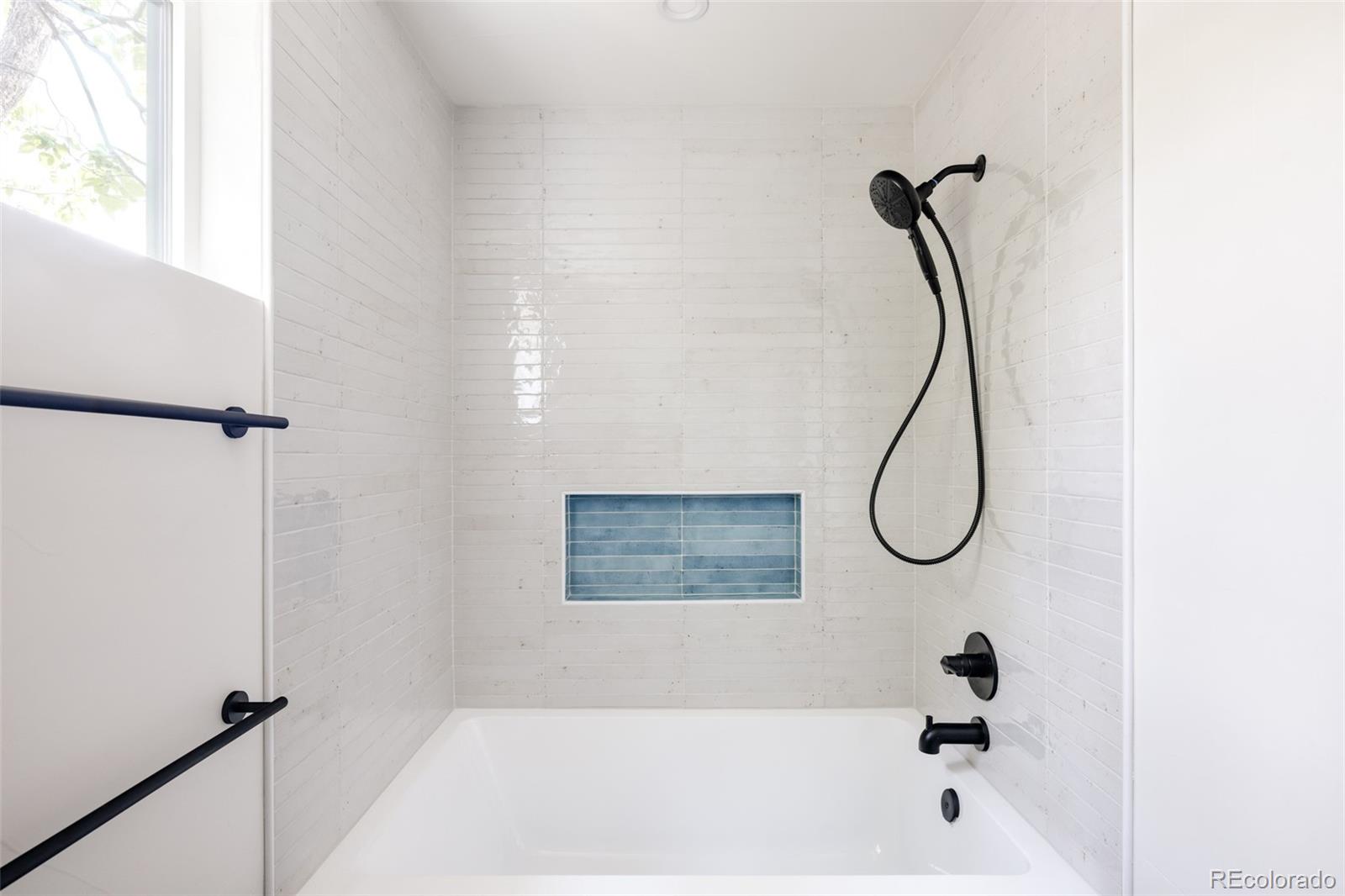 832 Adams Street Denver, CO 80206 - Photo 28 of 39 a bathroom with a shower and a shower