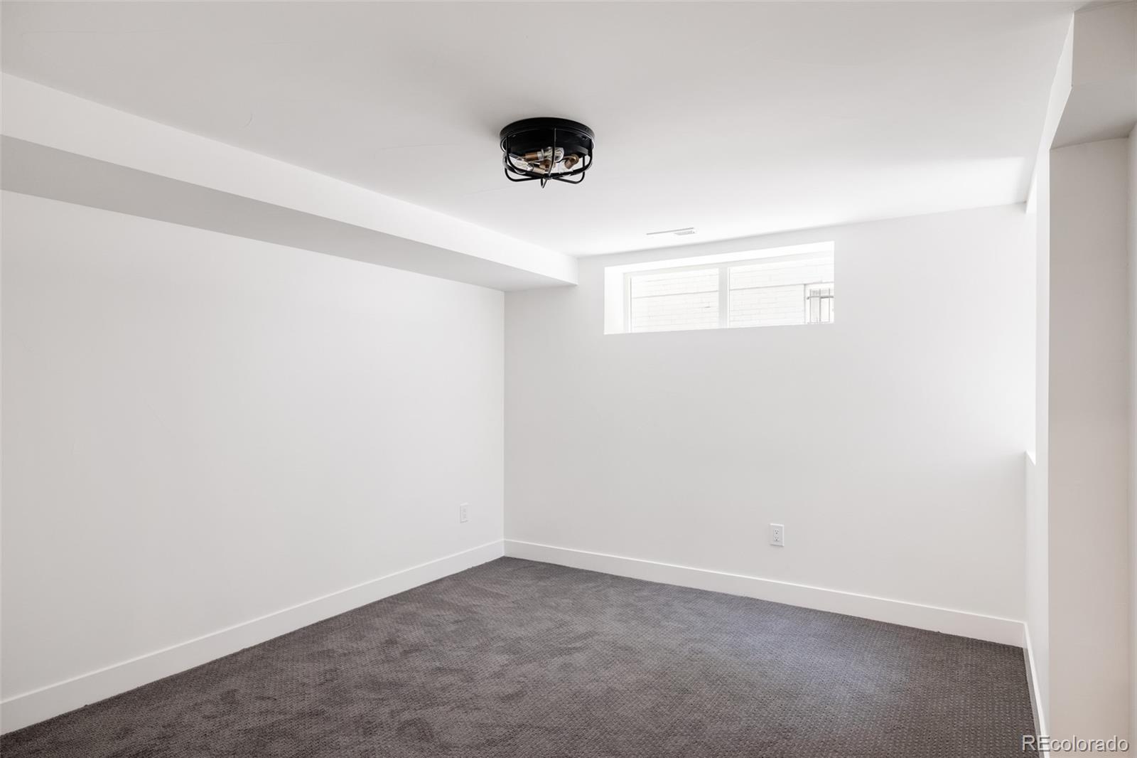 832 Adams Street Denver, CO 80206 - Photo 33 of 39 an empty room with a window