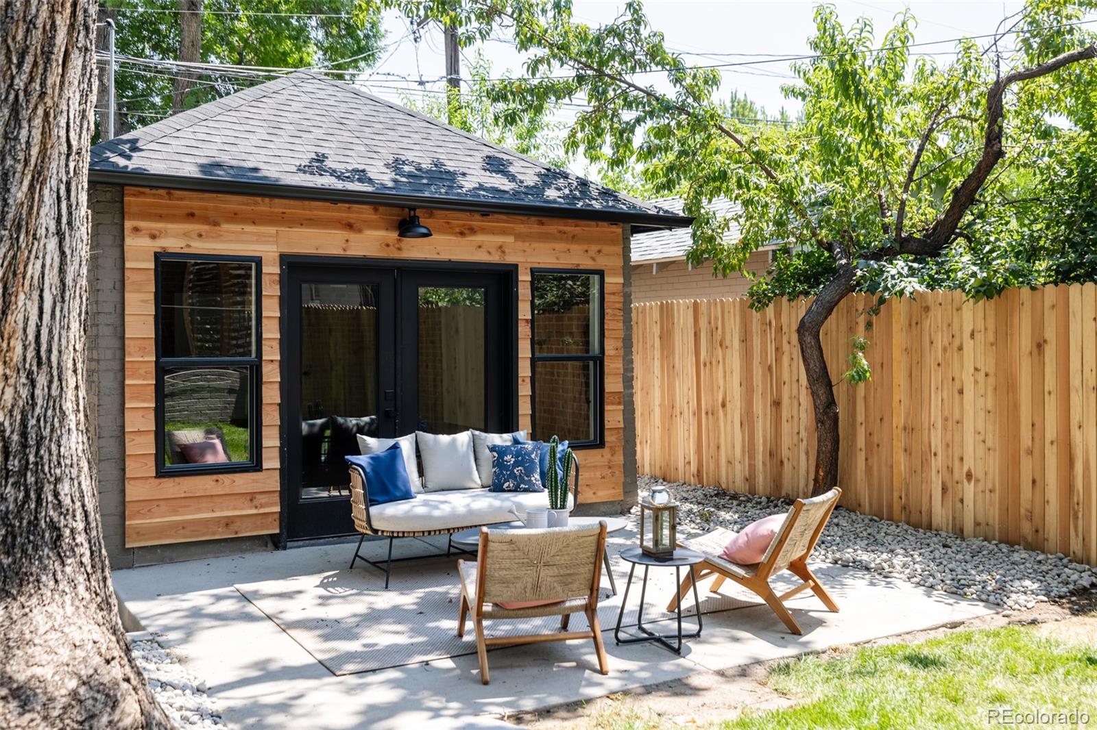 832 Adams Street Denver, CO 80206 - Photo 37 of 39 a view of a patio with couple of chairs and a table