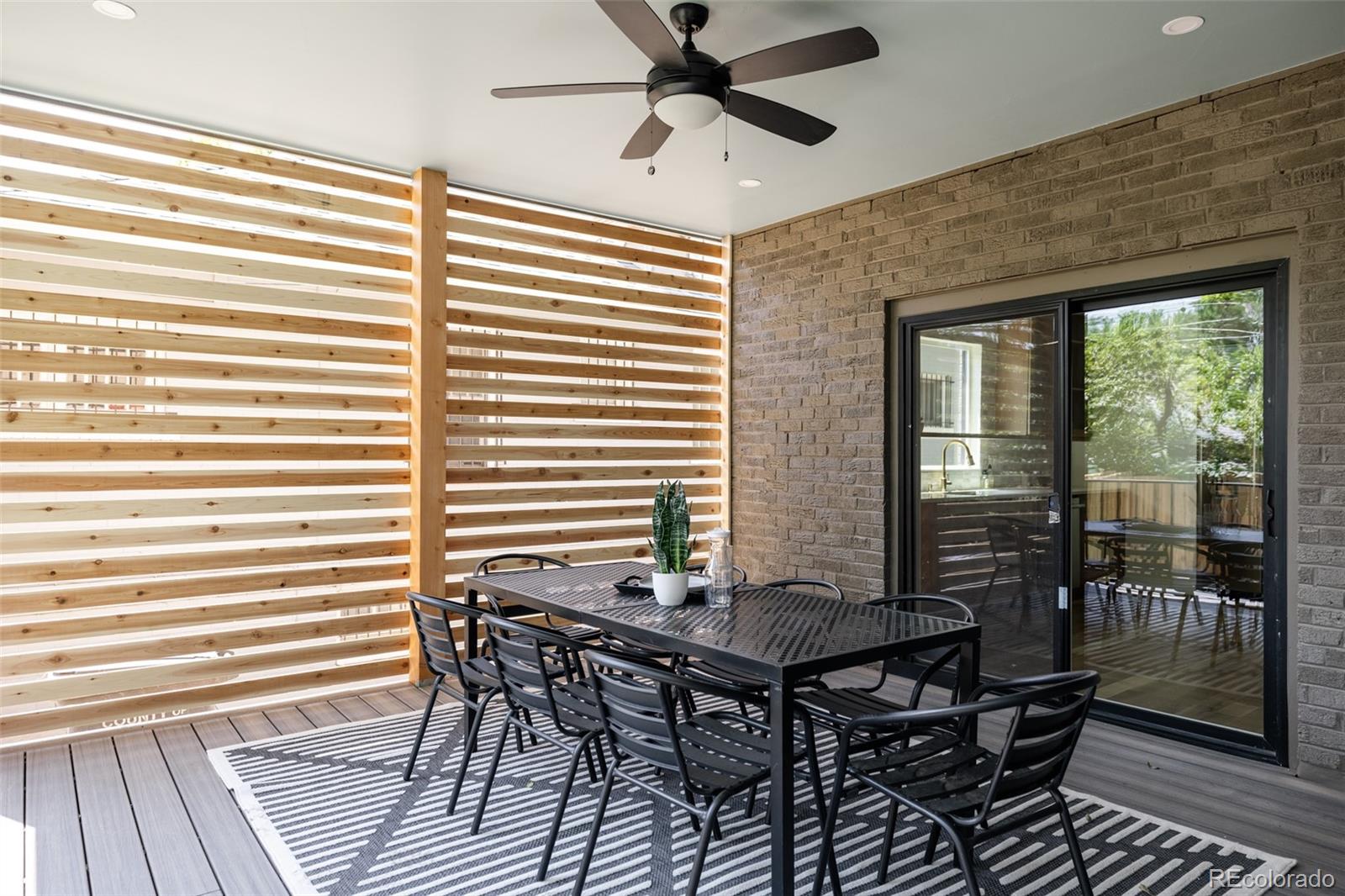 832 Adams Street Denver, CO 80206 - Photo 5 of 39 a view of a dining room with furniture and window