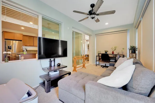 a bathroom with a sink vanity mirror and toilet