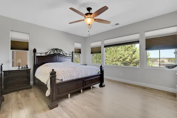 a bathroom with a sink a bathtub a mirror a toilet and a sink