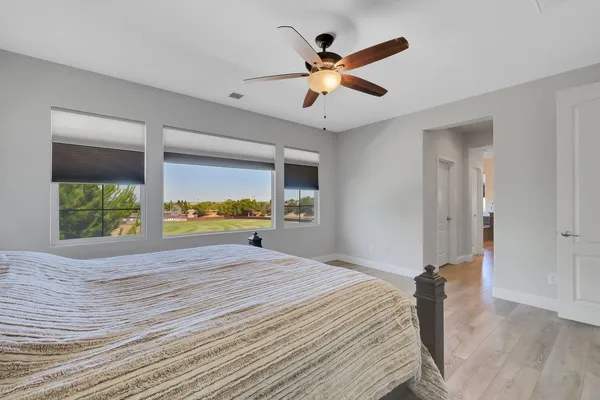 a bathroom with a tub sink shower and mirror