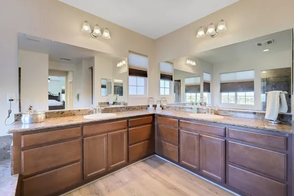 a spacious bedroom with a bed and a window