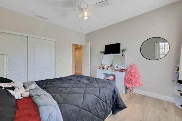 a bedroom with a bed and a dresser