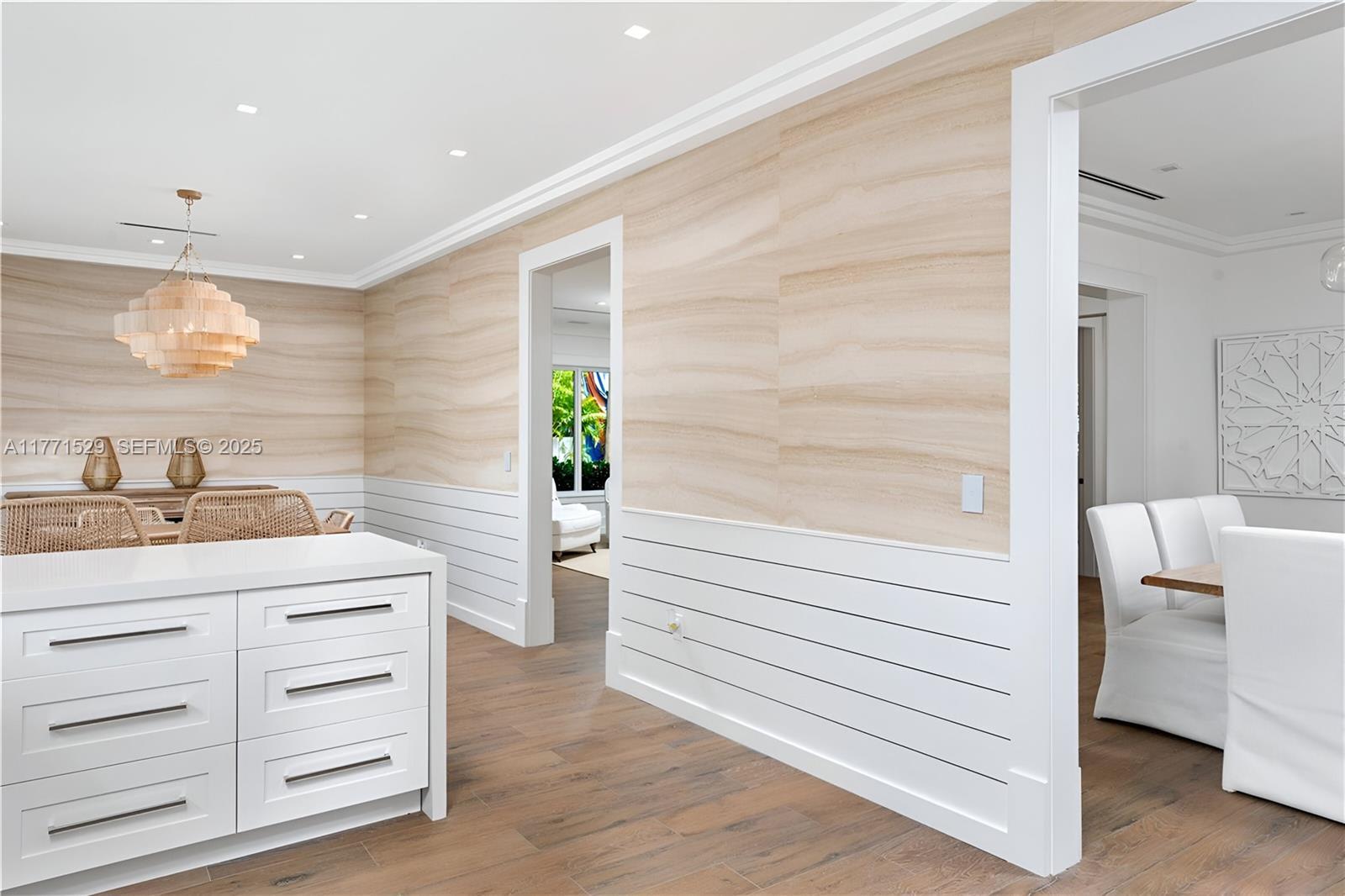 2575 Pine Tree Drive Miami Beach, FL 33140 - Photo 13 of 36 a bathroom with a sink a mirror and a shower