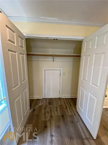 a view of front door with wooden floor