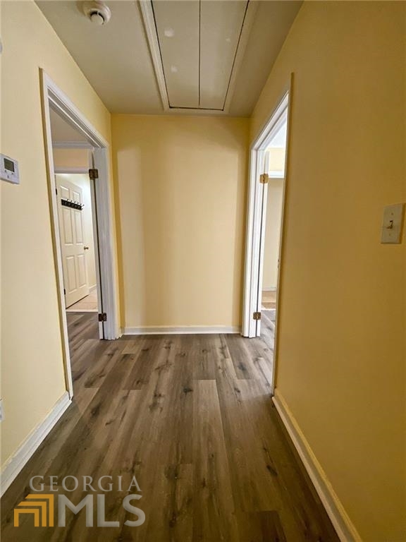 251 Holly Road Northwest Atlanta, GA 30314 - Photo 19 of 21 an empty room with wooden floor and a window