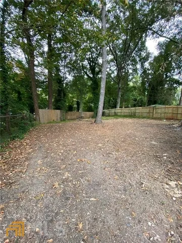 a view of a yard with a tree