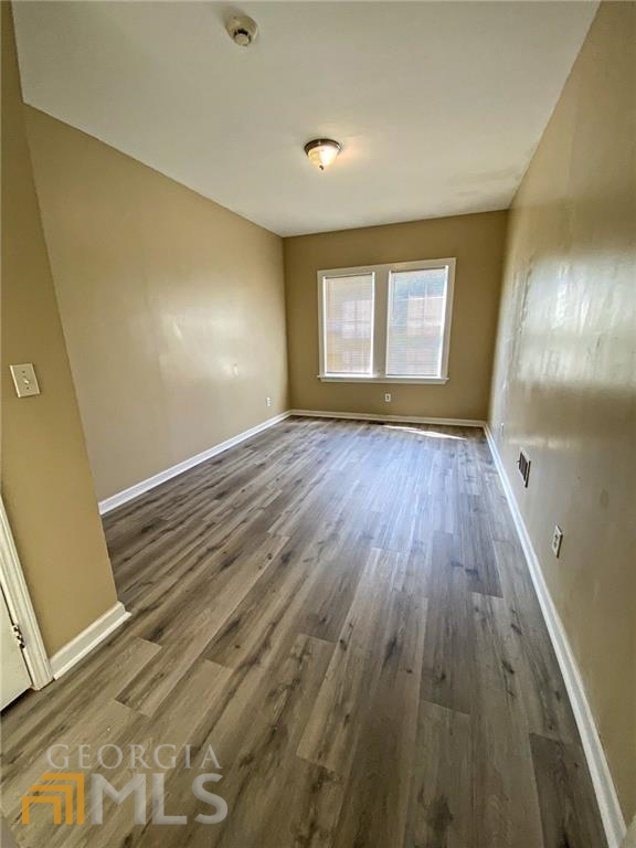 251 Holly Road Northwest Atlanta, GA 30314 - Photo 6 of 21 a view of empty room with wooden floor