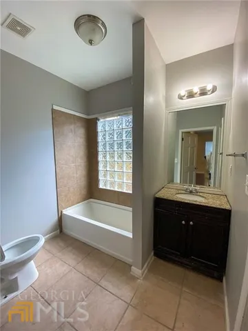 a bathroom with a sink and a bathtub