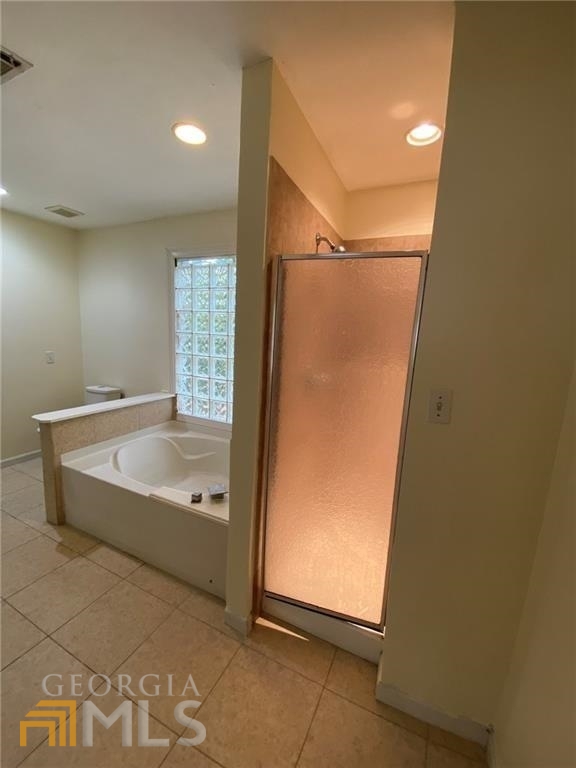251 Holly Road Northwest Atlanta, GA 30314 - Photo 10 of 21 a bathroom with a bathtub and shower