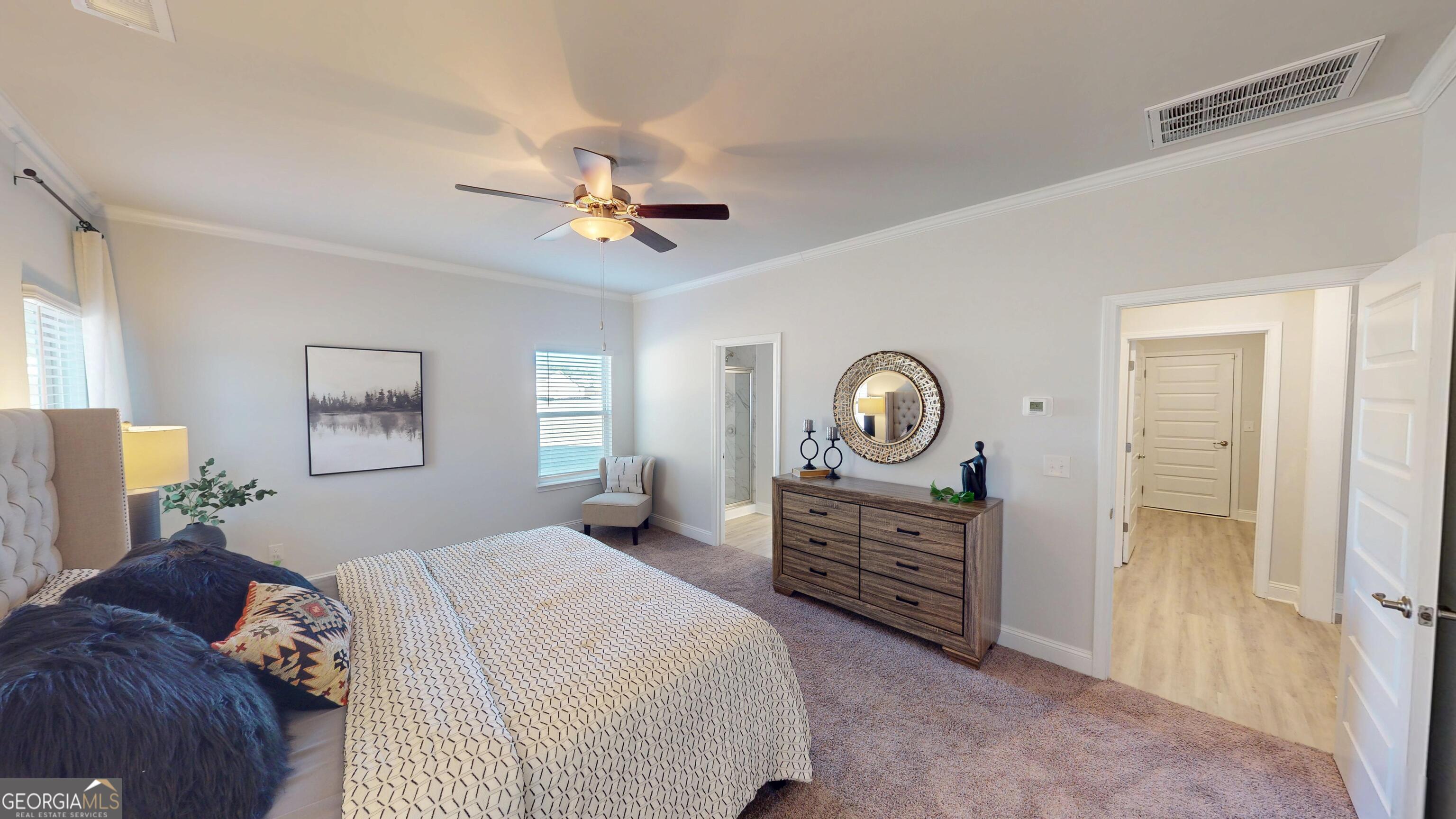 1007 Holiday Pass Griffin, GA 30223 - Photo 12 of 22 a bedroom with a bed dresser and a window