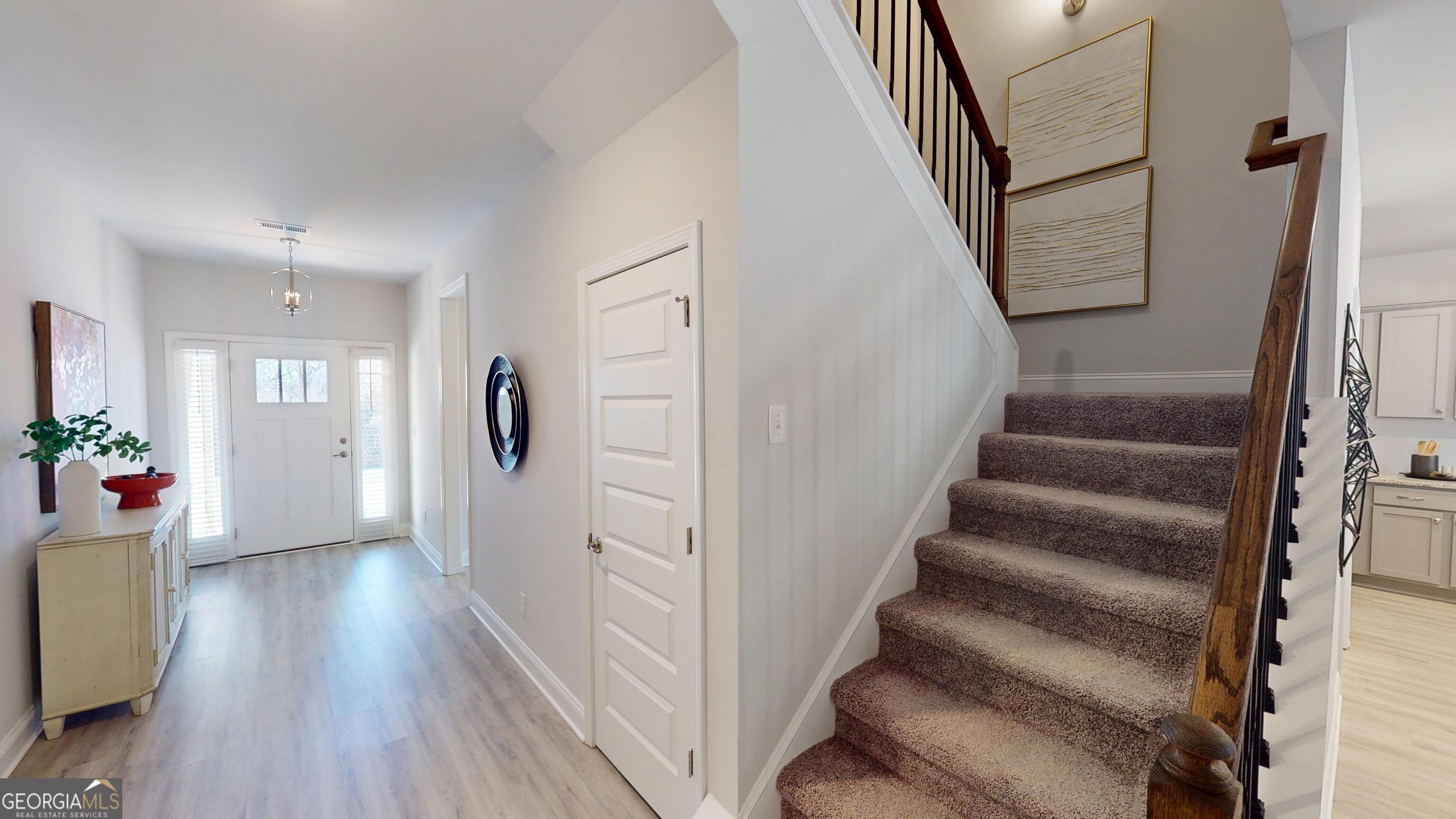 1007 Holiday Pass Griffin, GA 30223 - Photo 9 of 22 a view of entryway with wooden floor and stairs