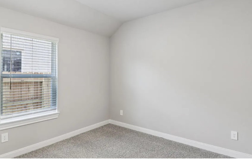 212 Raine Manor Montgomery, TX 77316 - Photo 6 of 12 an empty room with a window