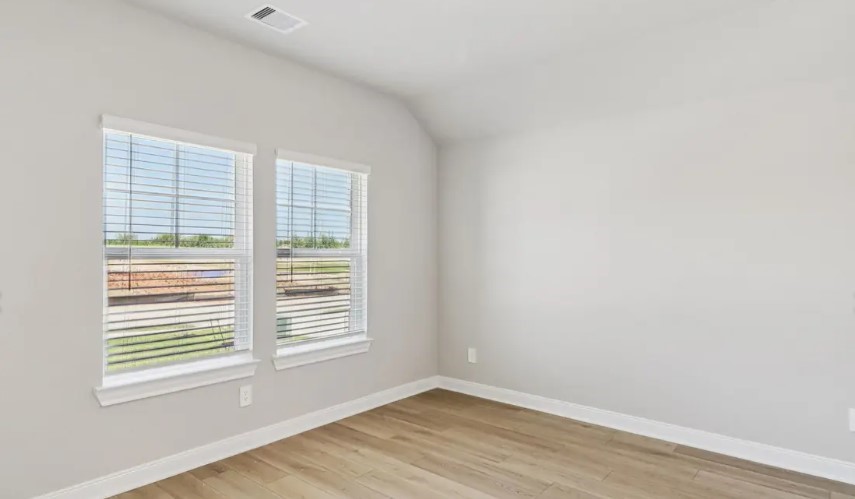 212 Raine Manor Montgomery, TX 77316 - Photo 8 of 12 a view of a room that has a window in it