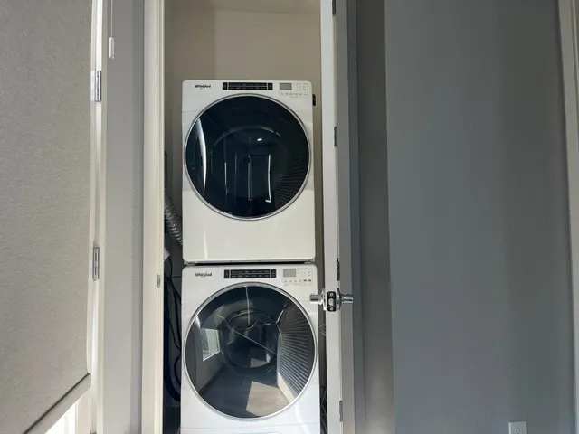 a view of hallway with wooden floor