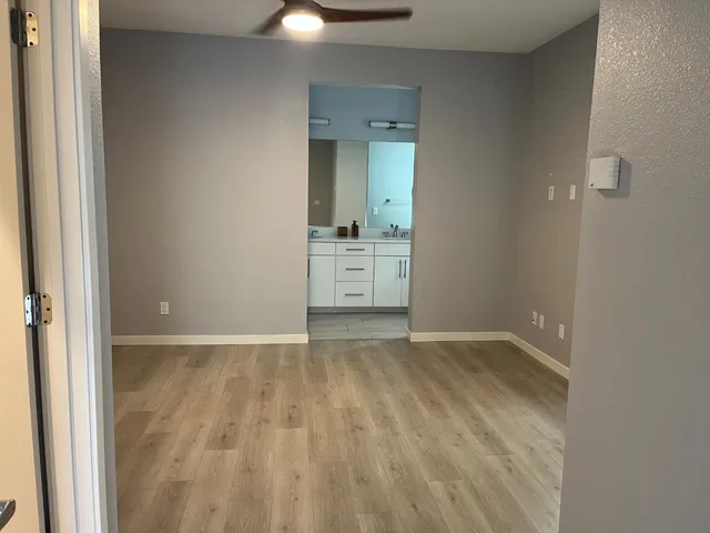 a bathroom with a double vanity sink and mirror