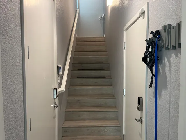 a view of an entryway with wooden floor